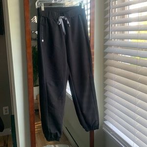 Figs, small, black joggers- above ankle